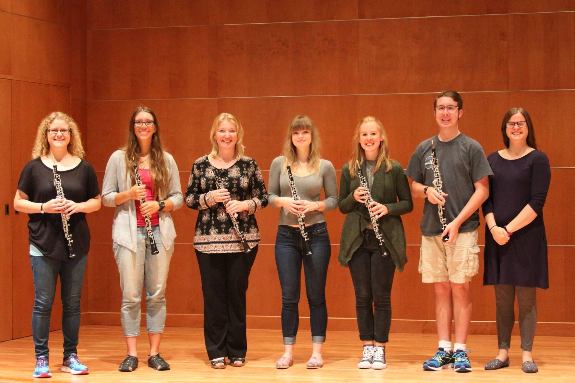 GVSU oboists in the Sherman Van Solkema Recital Hall holding their oboes